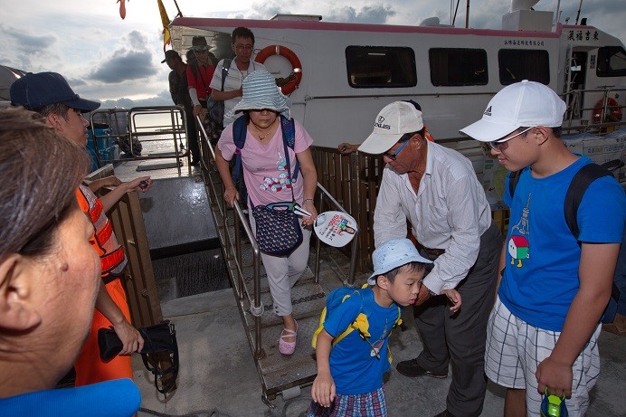 The park arranged for two volunteer workers to accompany the families on their trip