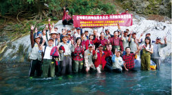 Taking part in the release of landlocked salmon fry with the mountain rangers and media